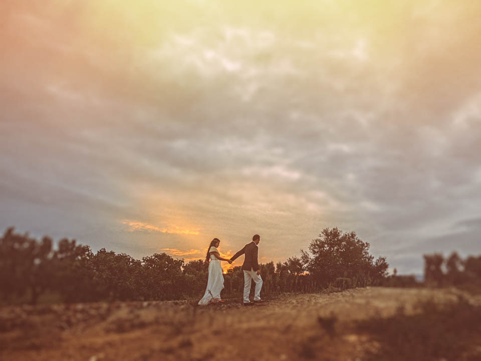 newlyweds at sunset